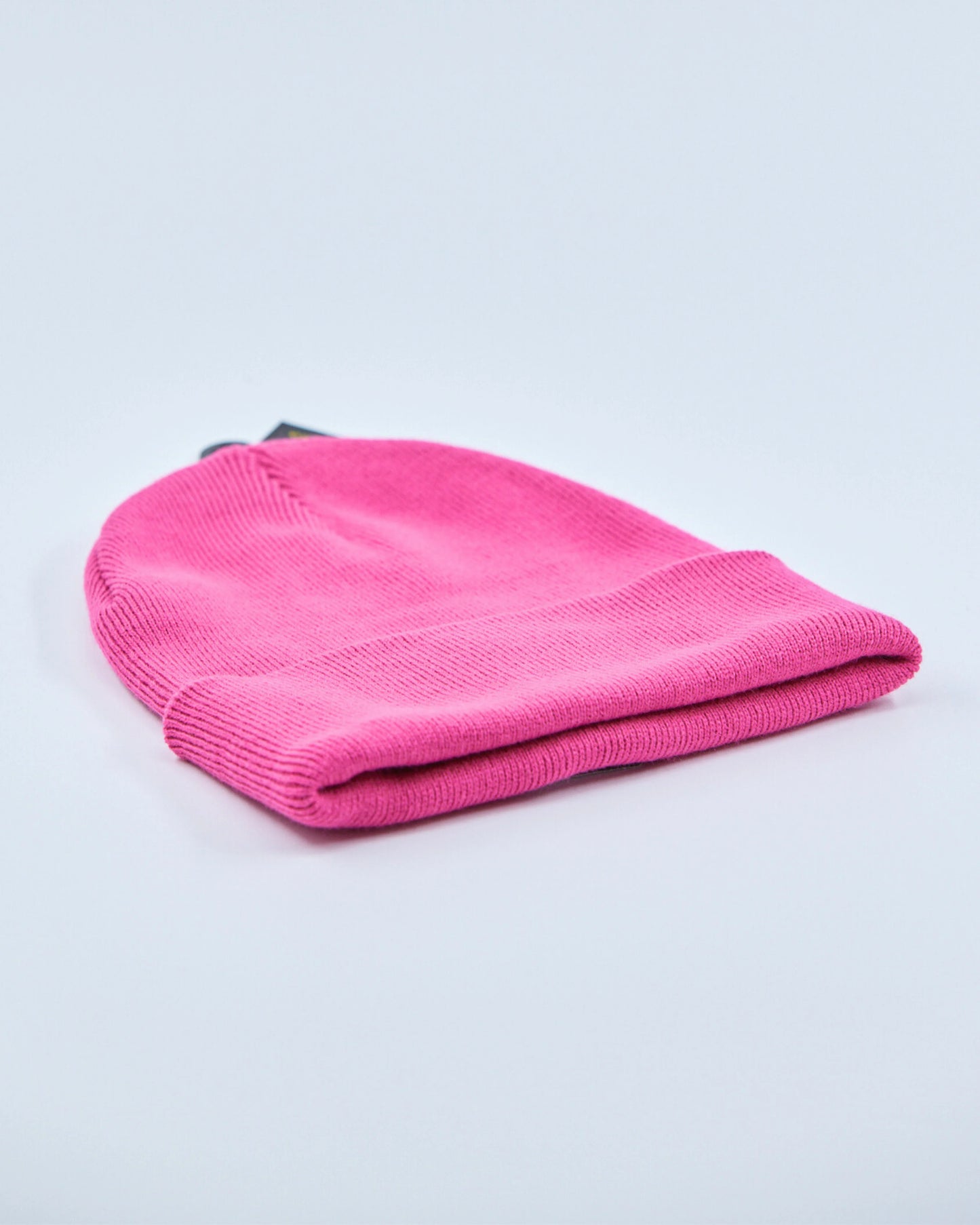 Pink beanie on a light gray background