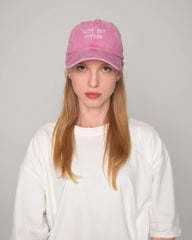 woman wearing Pink Cute But Psycho Washed Cap Hat