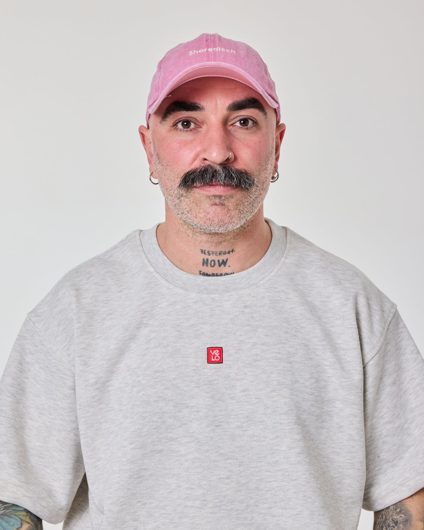 front view of a man wearing Shoreditch Pink Washed Cap