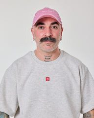 front view of a man wearing Shoreditch Pink Washed Cap