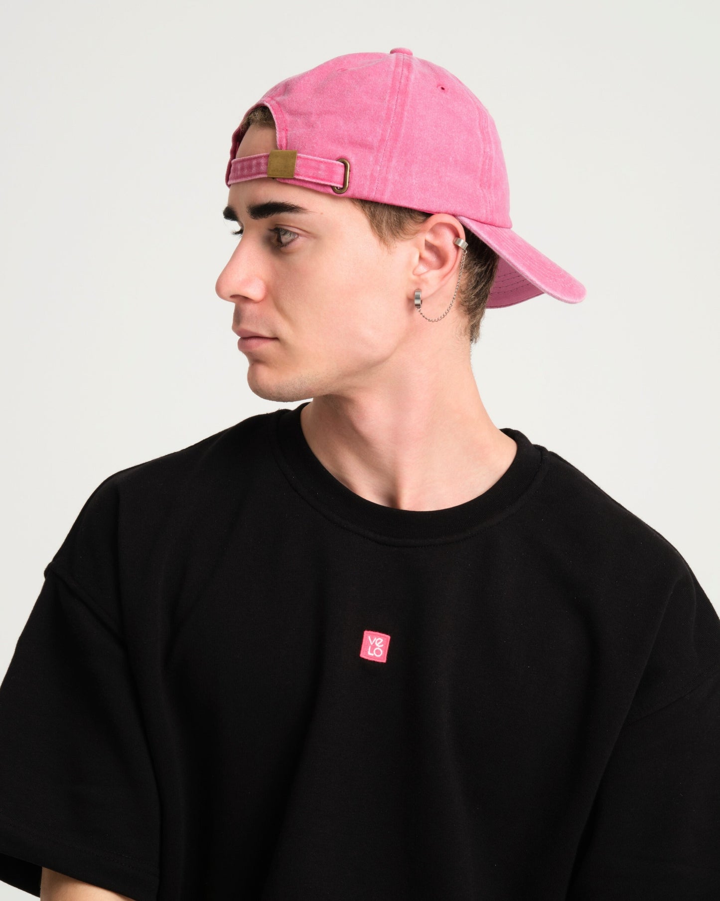 side view of a man wearing Shoreditch Pink Washed Cap