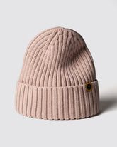 Powder Pink Classic Beanie with a brand logo on a light gray background
