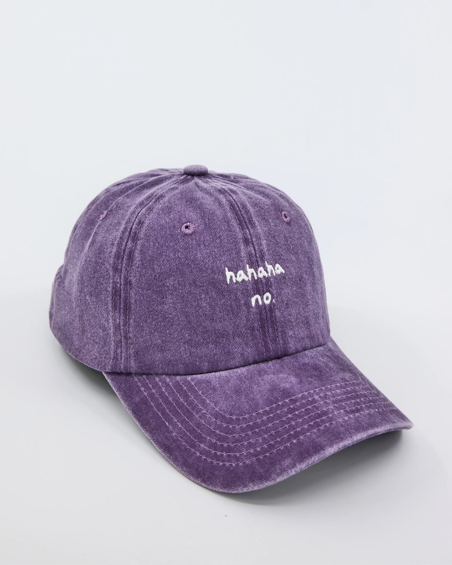 side view of Hahaha No Purple Washed Cap