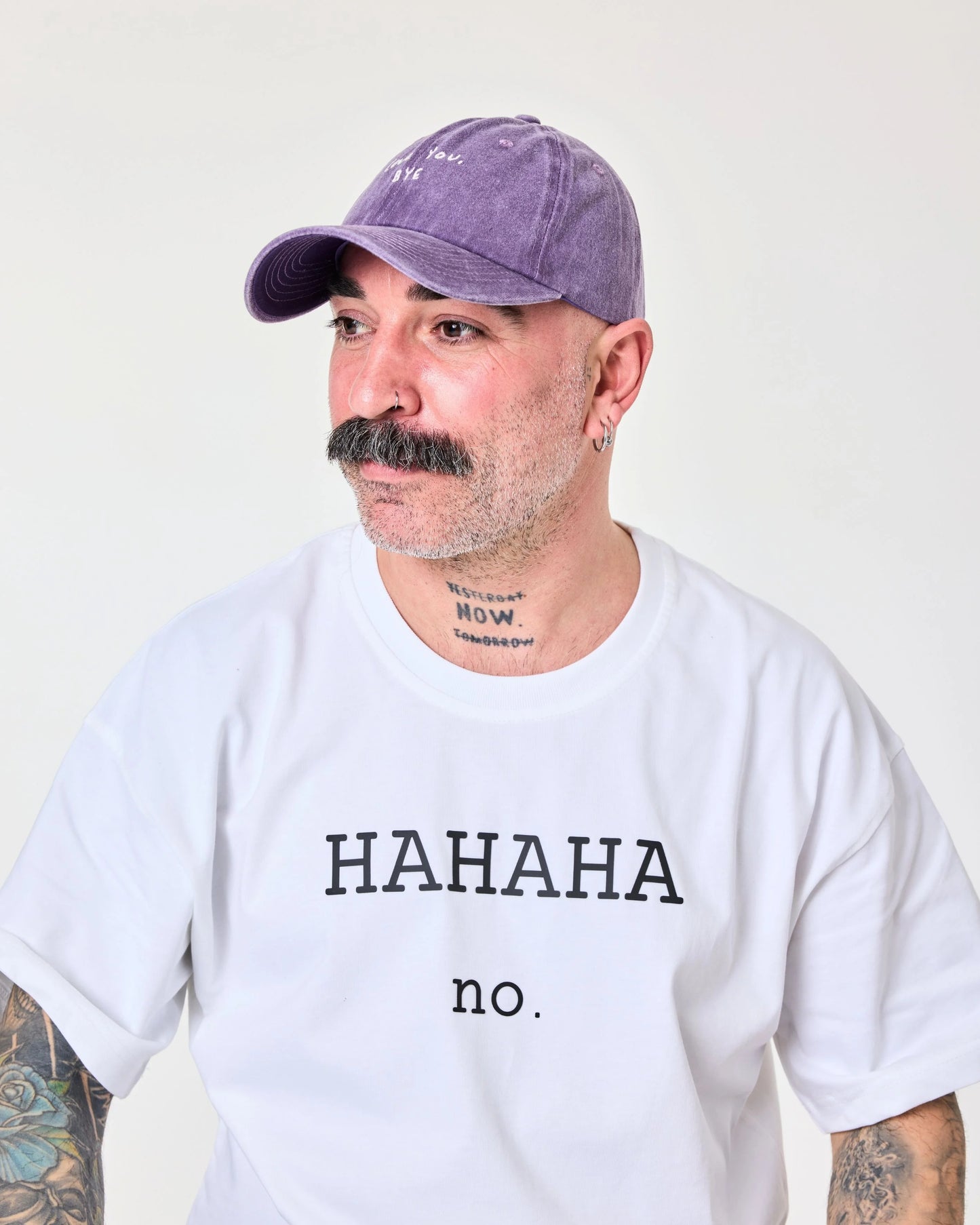 man wearing purple washed cap with 'Love You, Bye' embroidered in white