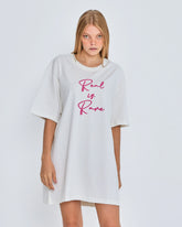 White oversized t-shirt with 'Real is Rare' text on a plain background