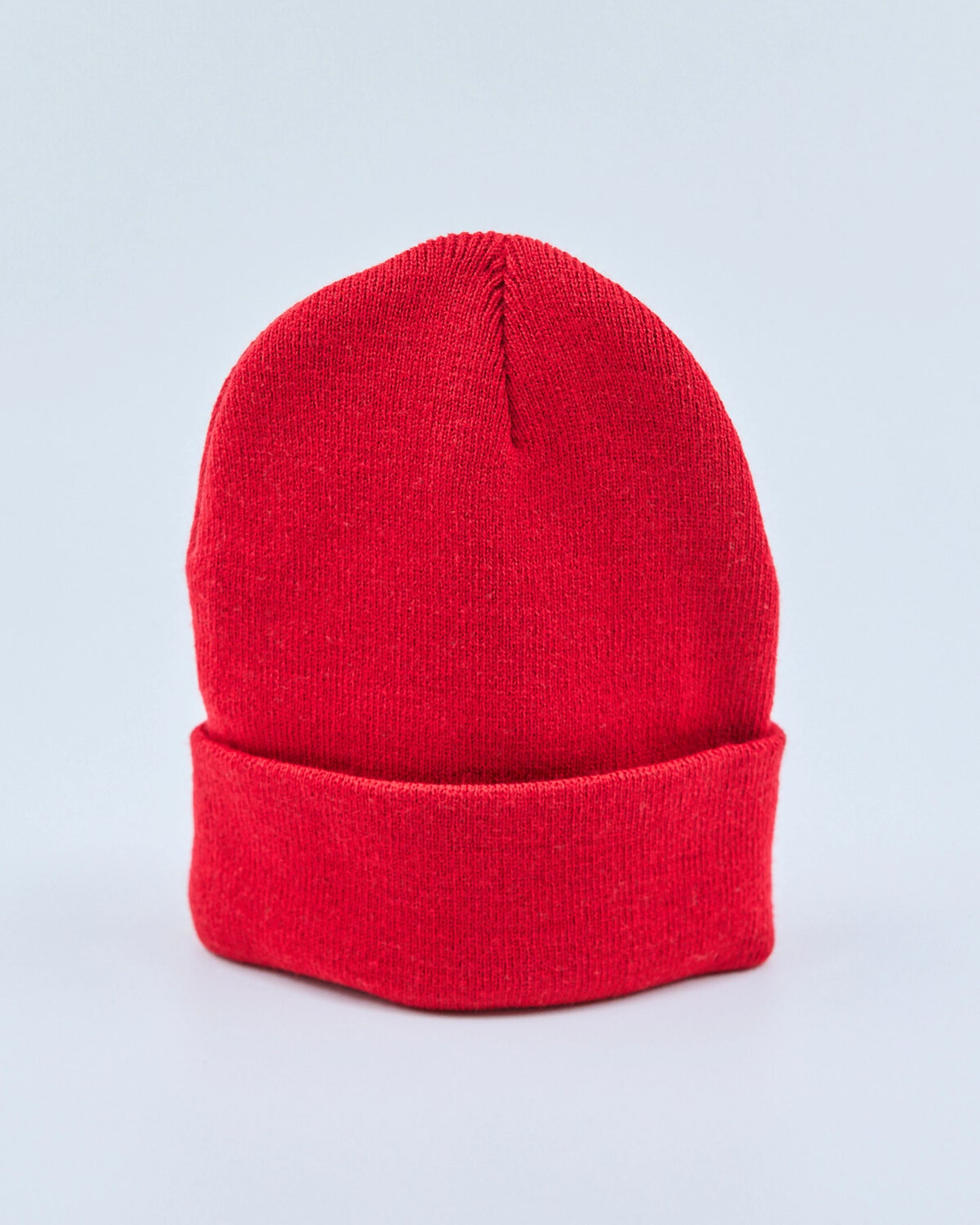 Red beanie on a light gray background