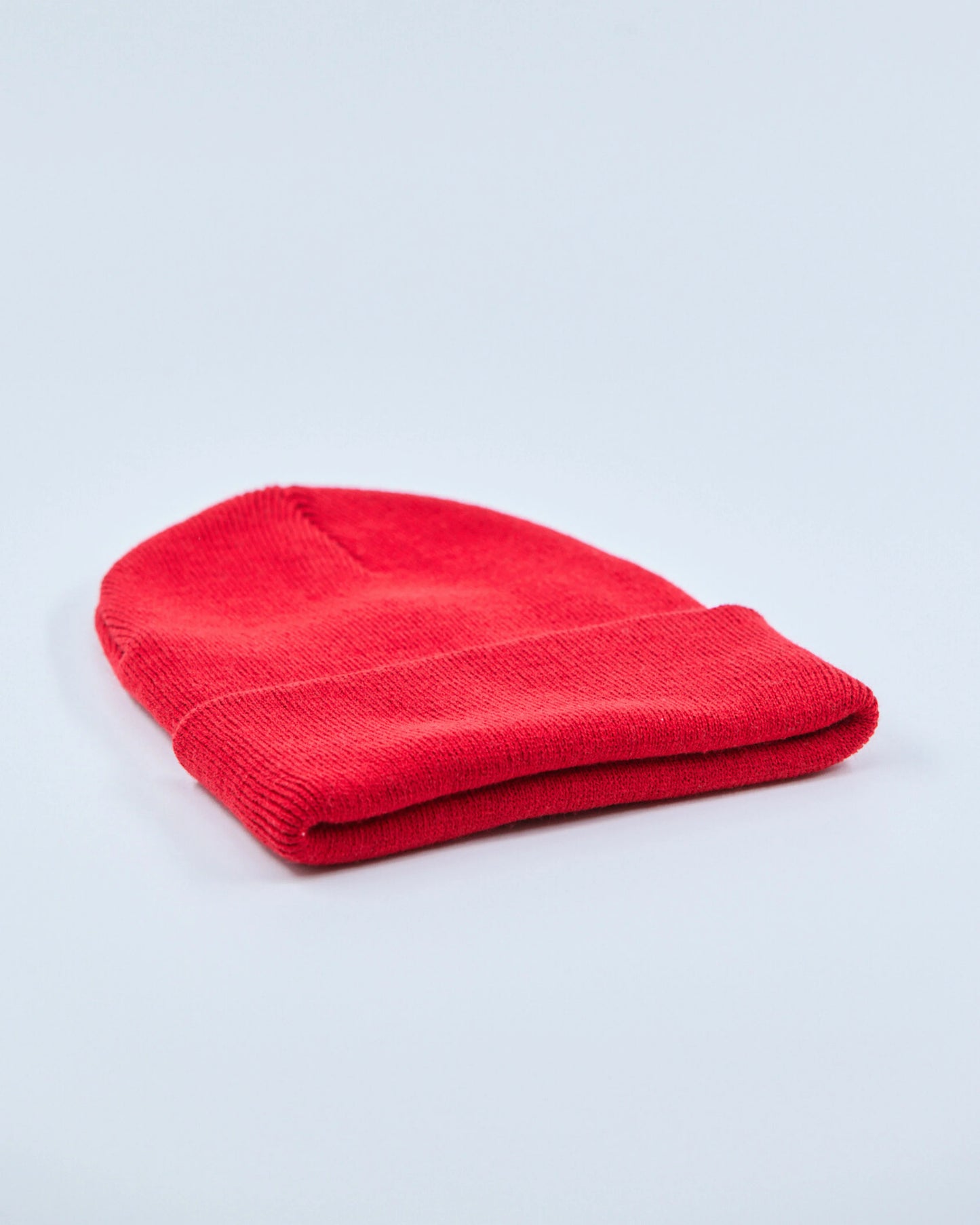 Red beanie on a light gray background