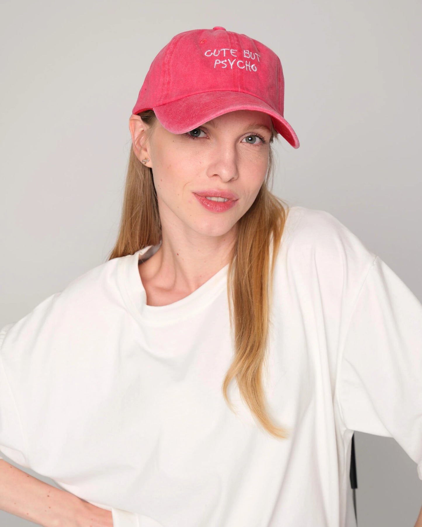 front view of woman wearing Cute But Psycho Red Washed Caps