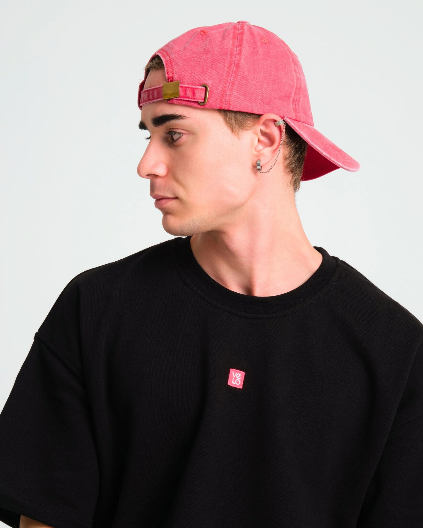side view of man wearing Cute But Psycho Red Washed Caps