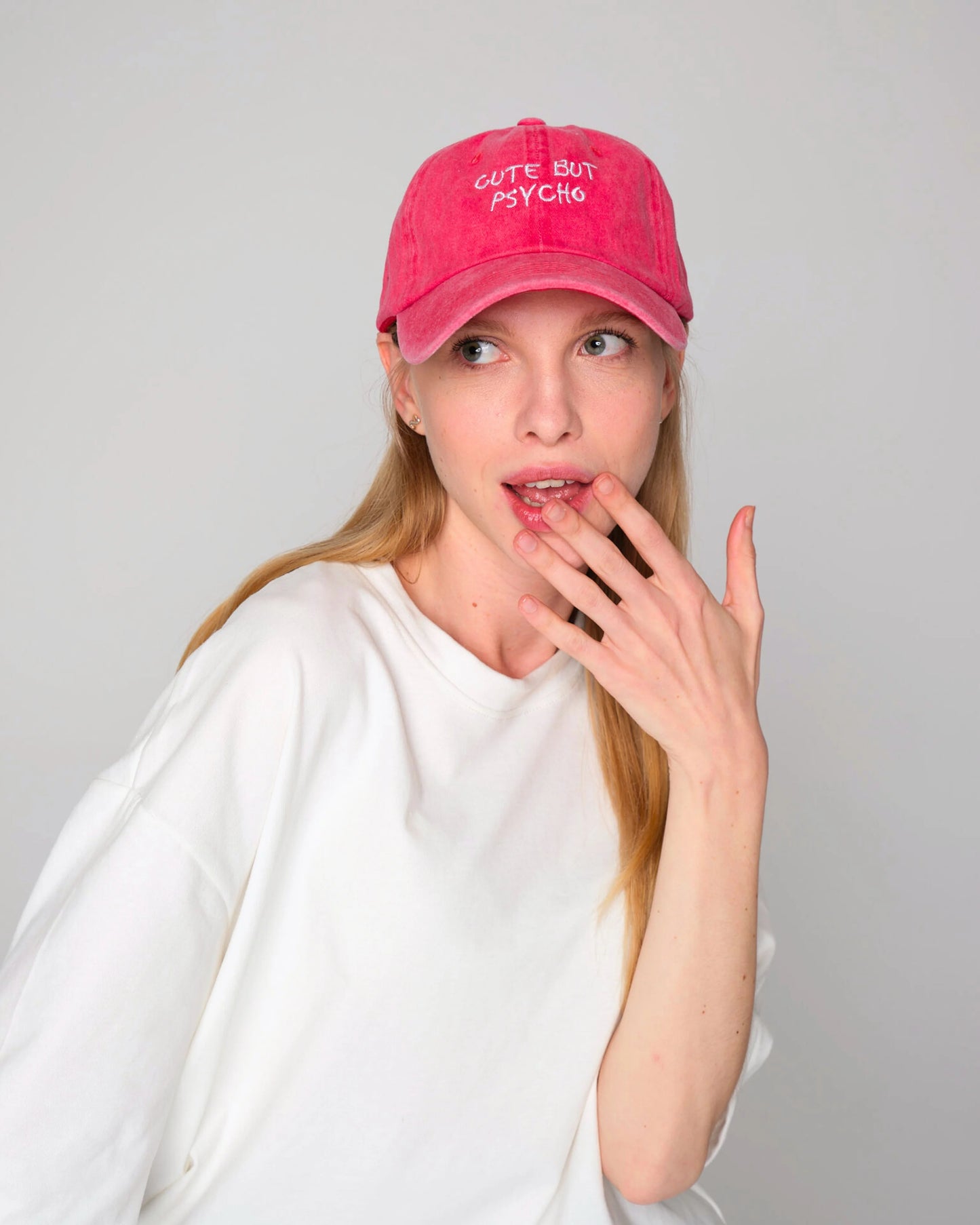 front view of woman wearing Cute But Psycho Red Washed Caps Hat