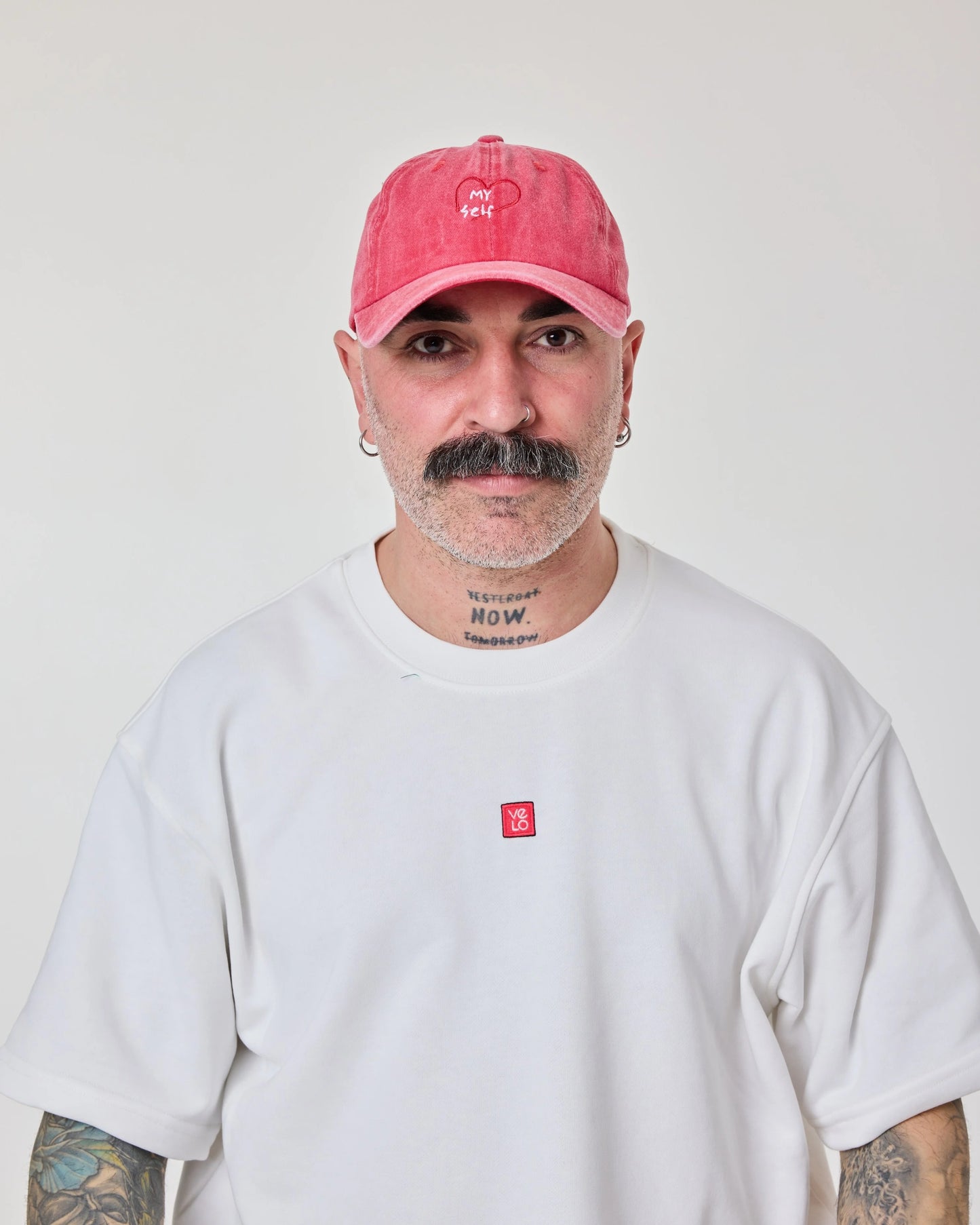 man wearing Red Love Myself Washed Cap