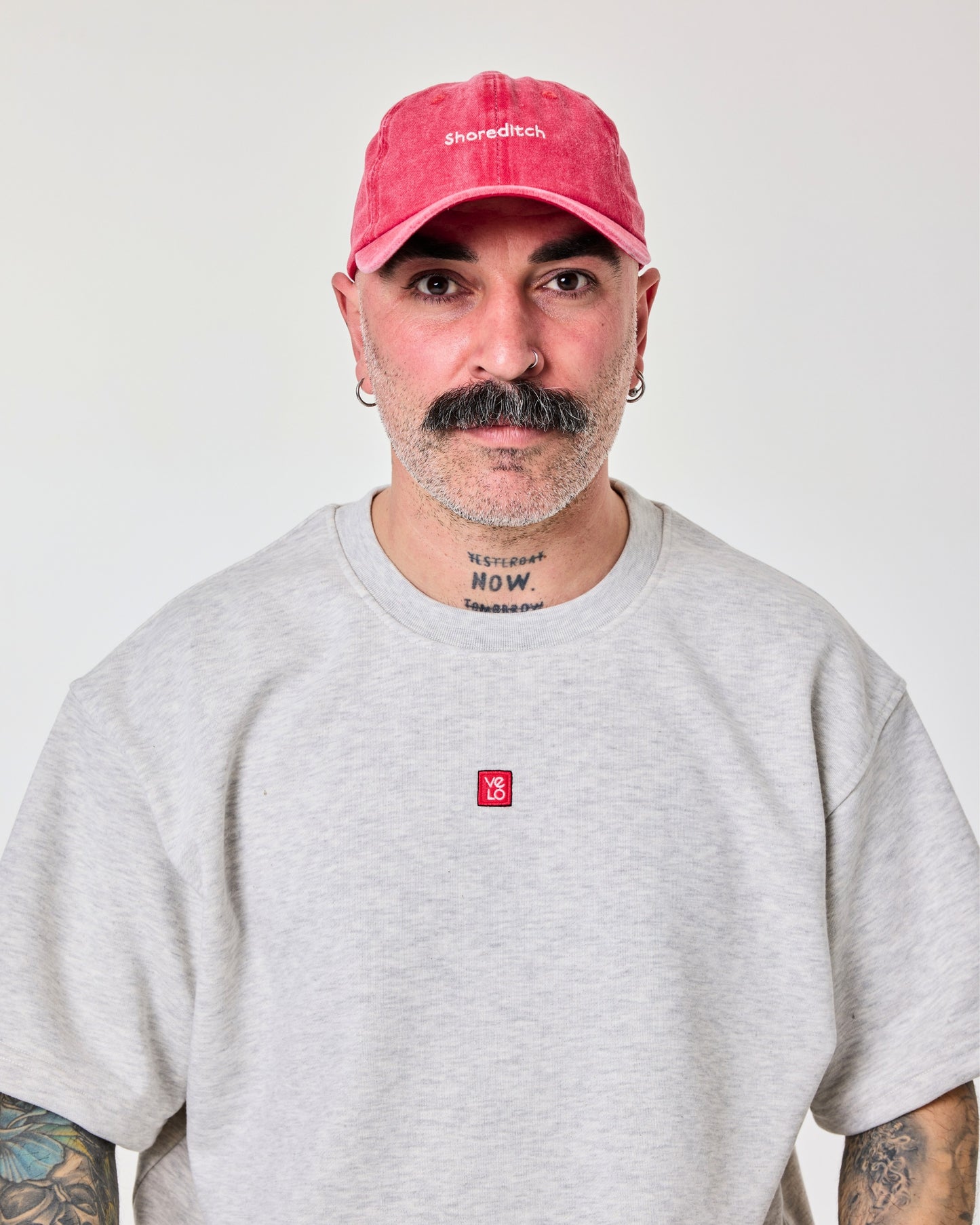 front view of a man wearing Shoreditch Red Washed Cap