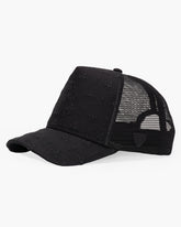 Black trucker cap with embroidered design on a white background