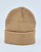 Beige beanie on a light gray background