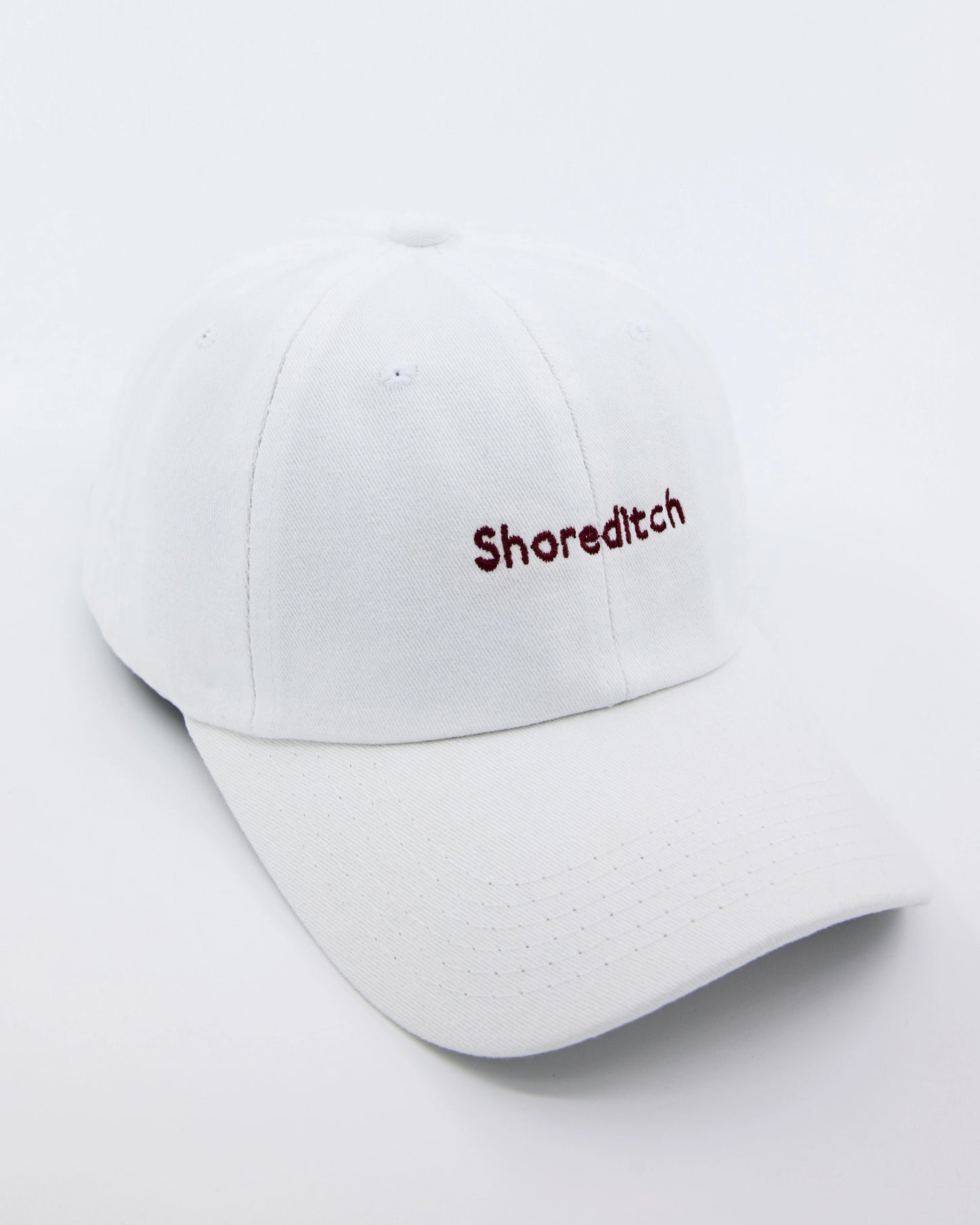 side look of shoreditch embroidered white cap