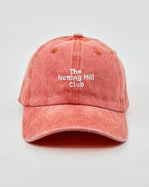 front view of The Notting Hill Club Orange Washed Cap