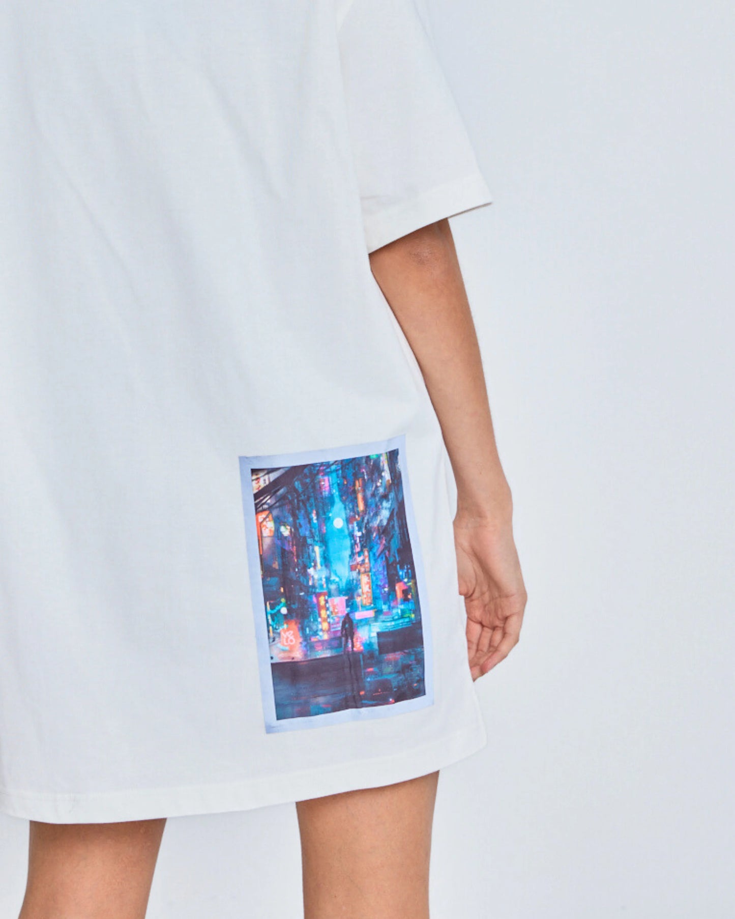 White t-shirt with a colorful print on a white background