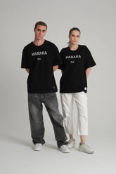 front view of male and female model wearing hahaha no black tee