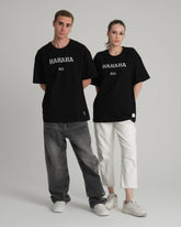 front view of male and female model wearing hahaha no black tee