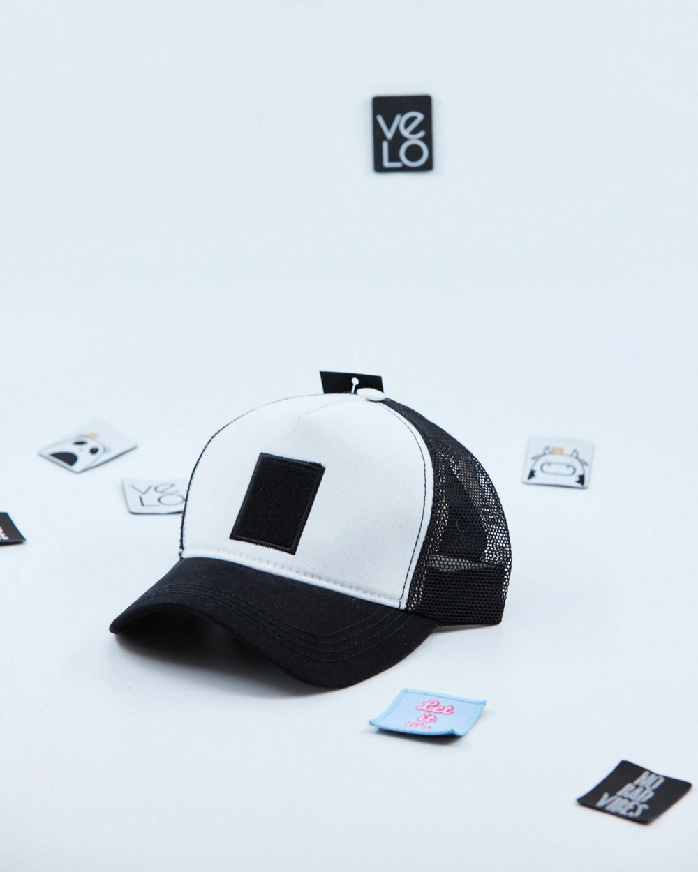 Side view of White and Black Customisable Trucker Cap