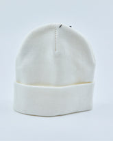 White beanie on a light gray background