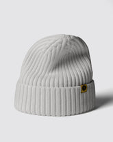 White Classic Beanie with a brand logo on a light gray background
