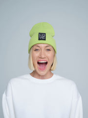 model wearing light green patch ready beanie with LOVE text patch on the front