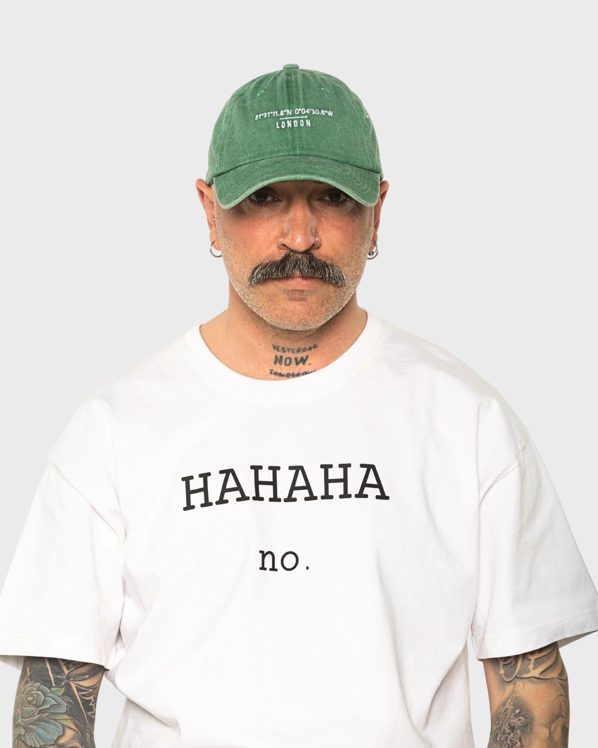 A man wearing the London Green Washed Cap