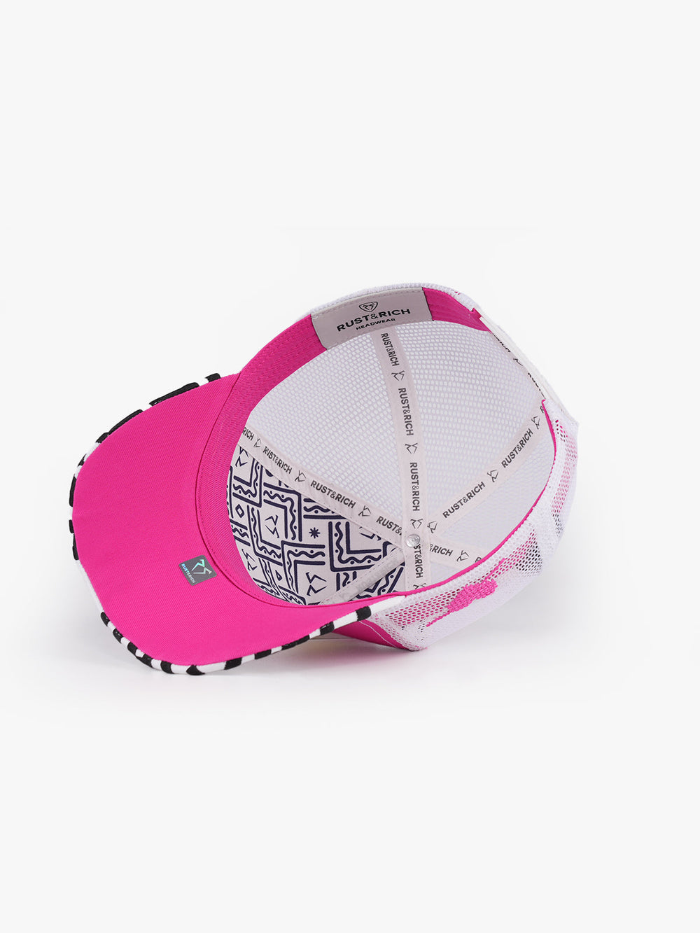 What pink and white trucker cap embroidered side detail