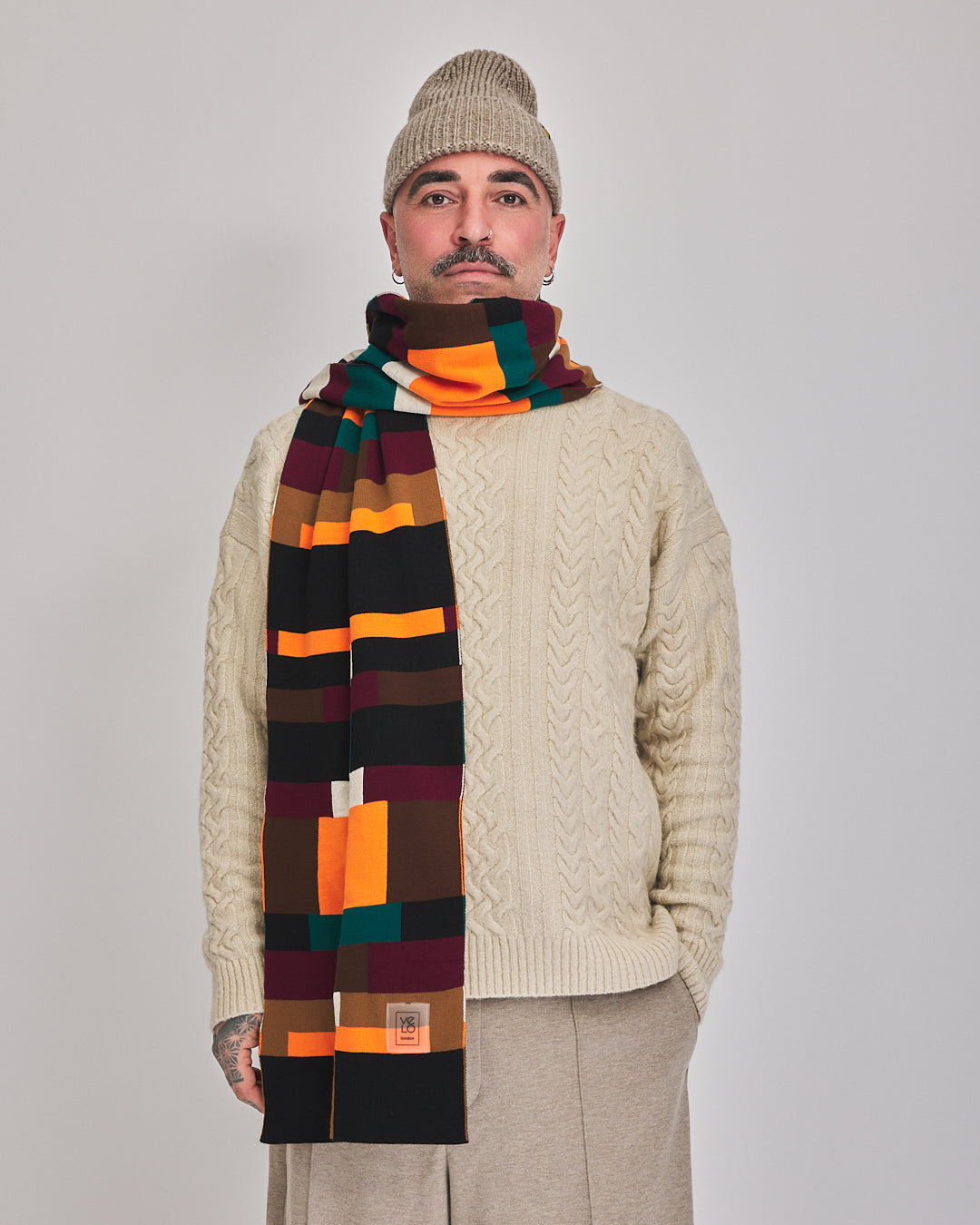 Brick Grid unisex oversized scarf styled with cream knitwear, front view
