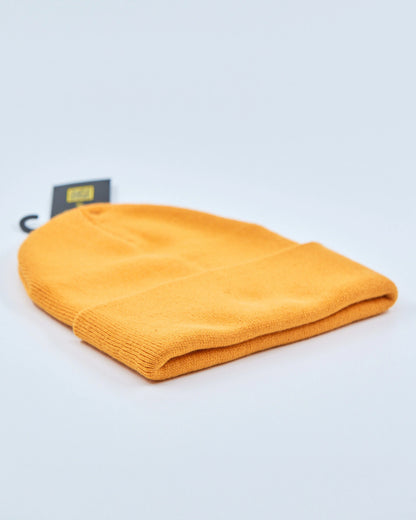 Amber beanie on a light gray background