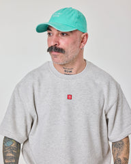 man wearing Cute But Psycho Aqua Blue Washed Cap Hat