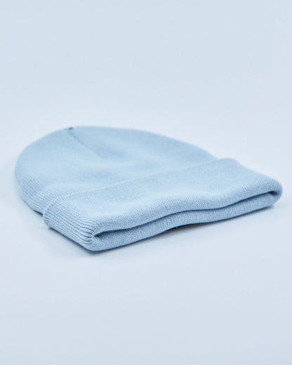 Light blue beanie on a light gray background