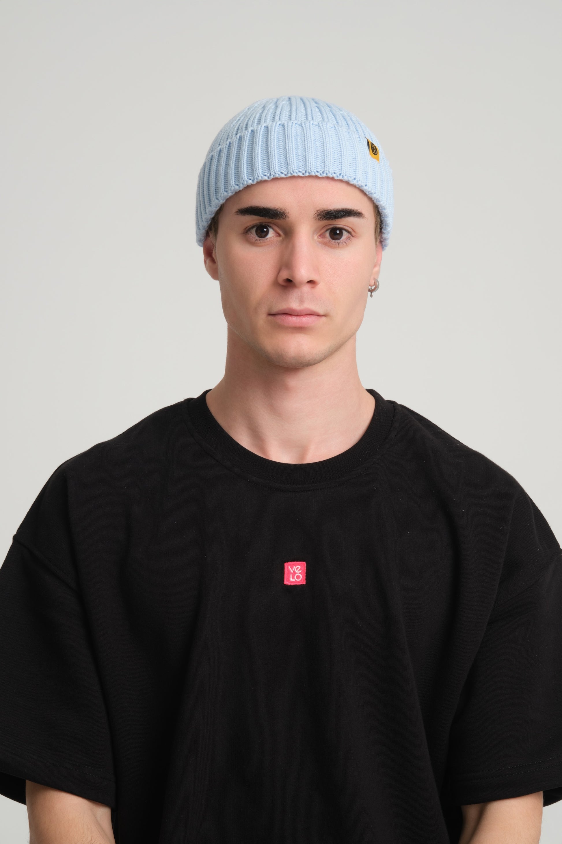 front view of a man wearing Baby Blue Fisherman Beanie