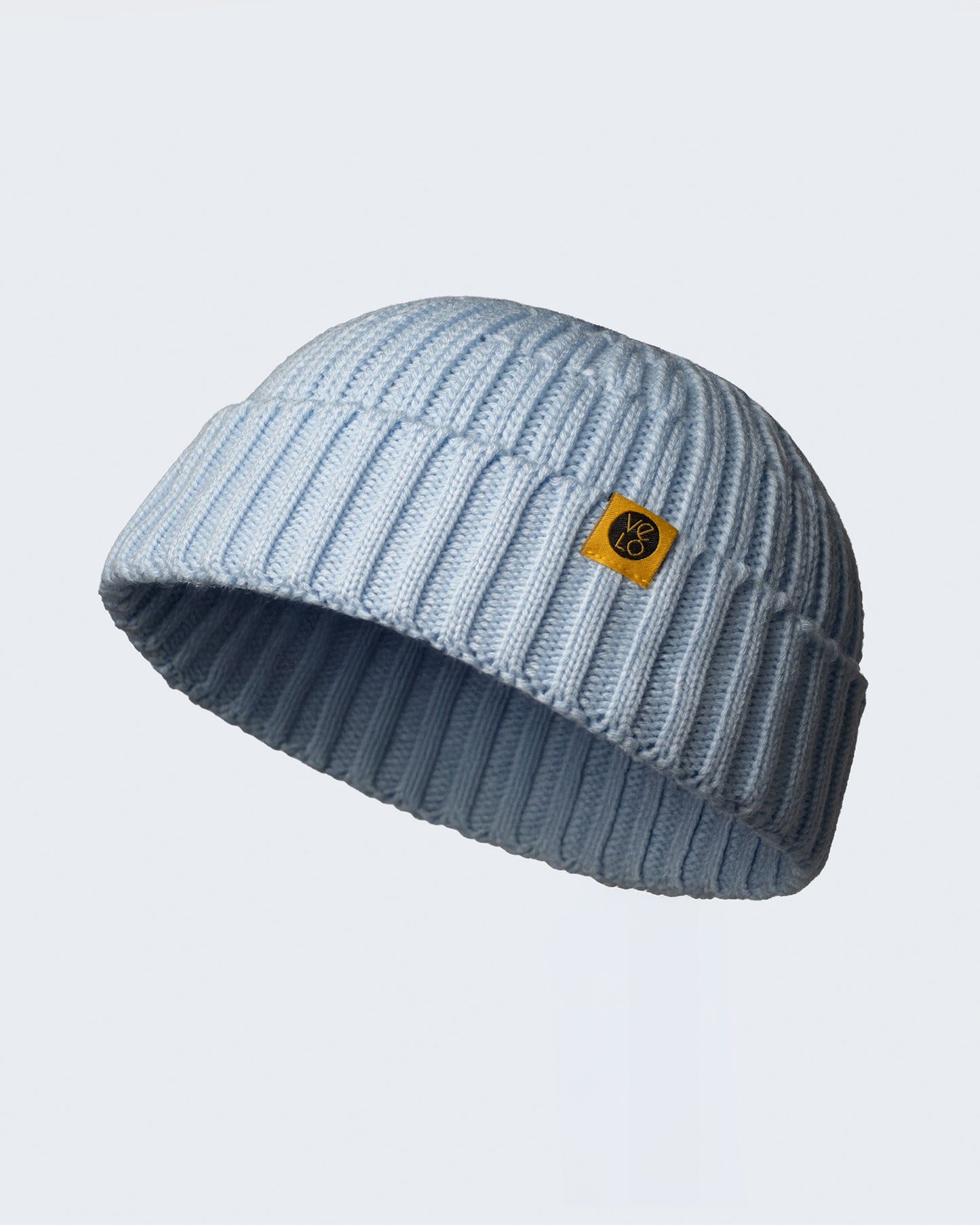 side look of baby blue fisherman beani on a white background