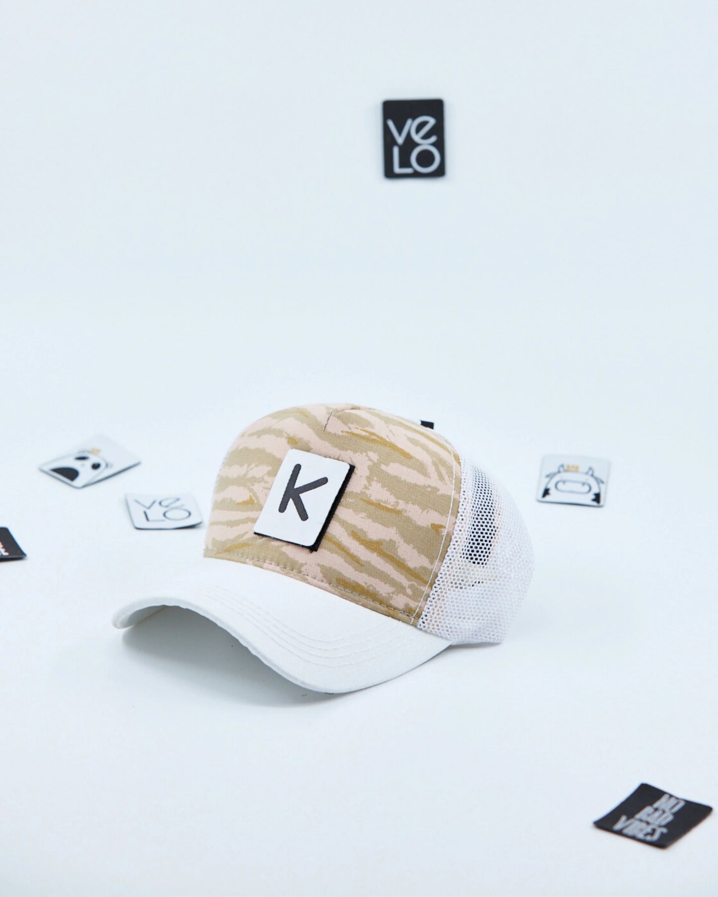 Side view of Beige Tiger and White Customisable Trucker Cap with patches