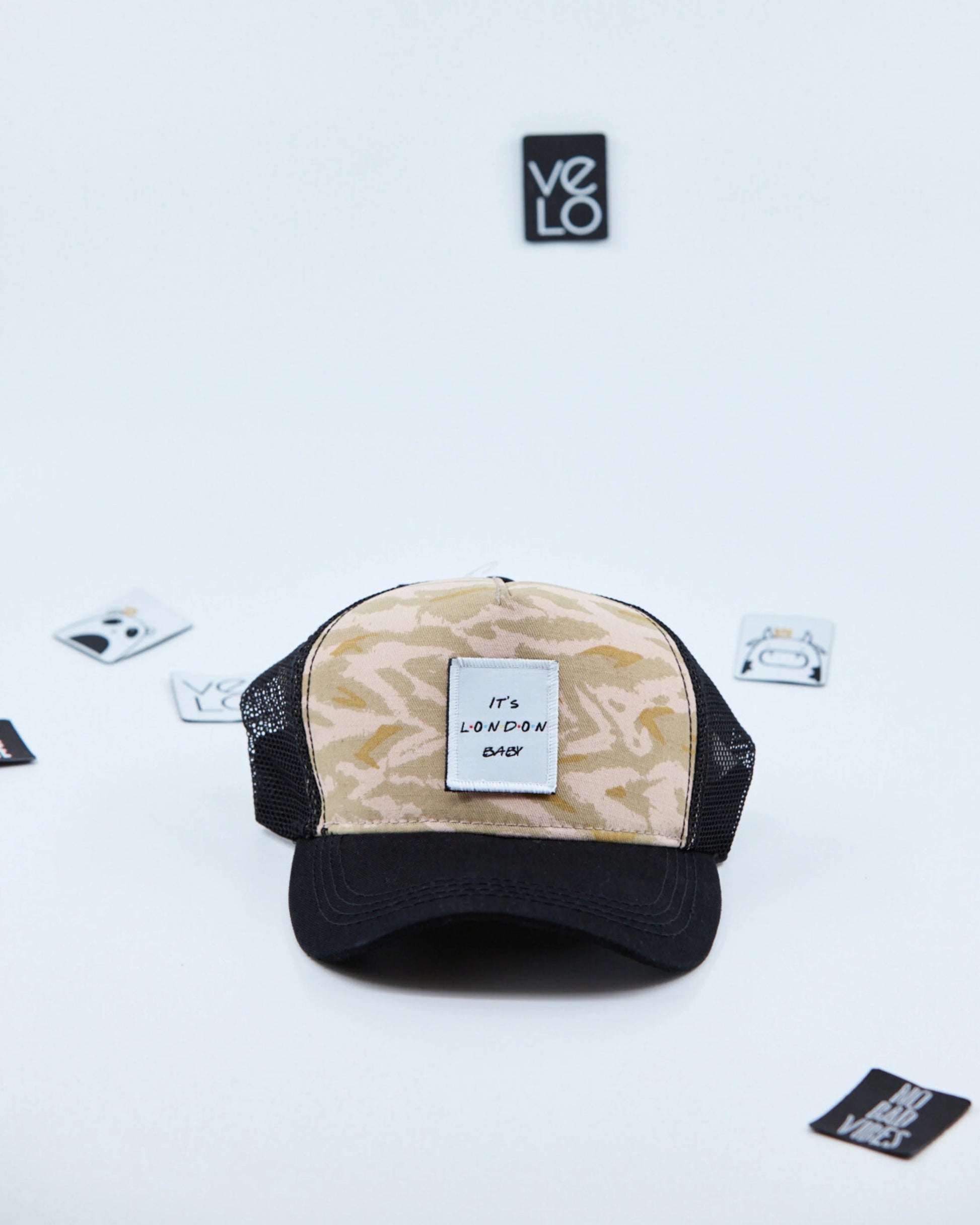 Front view of Beige Zebra and Black Trucker Cap