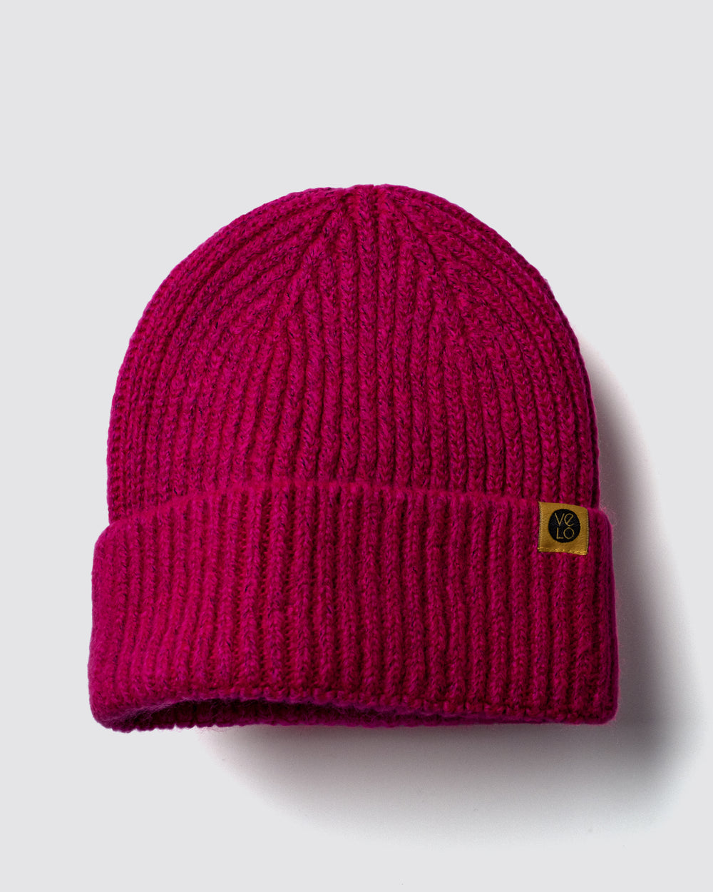 Berry Pink Lux Beanie on a light gray background