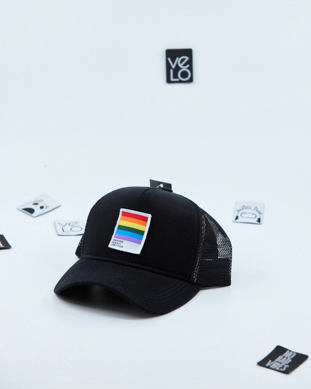 Side view of Black and Black Meshed Trucker Cap