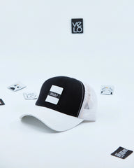 Side view of Black and White Customisable Trucker Cap with patches