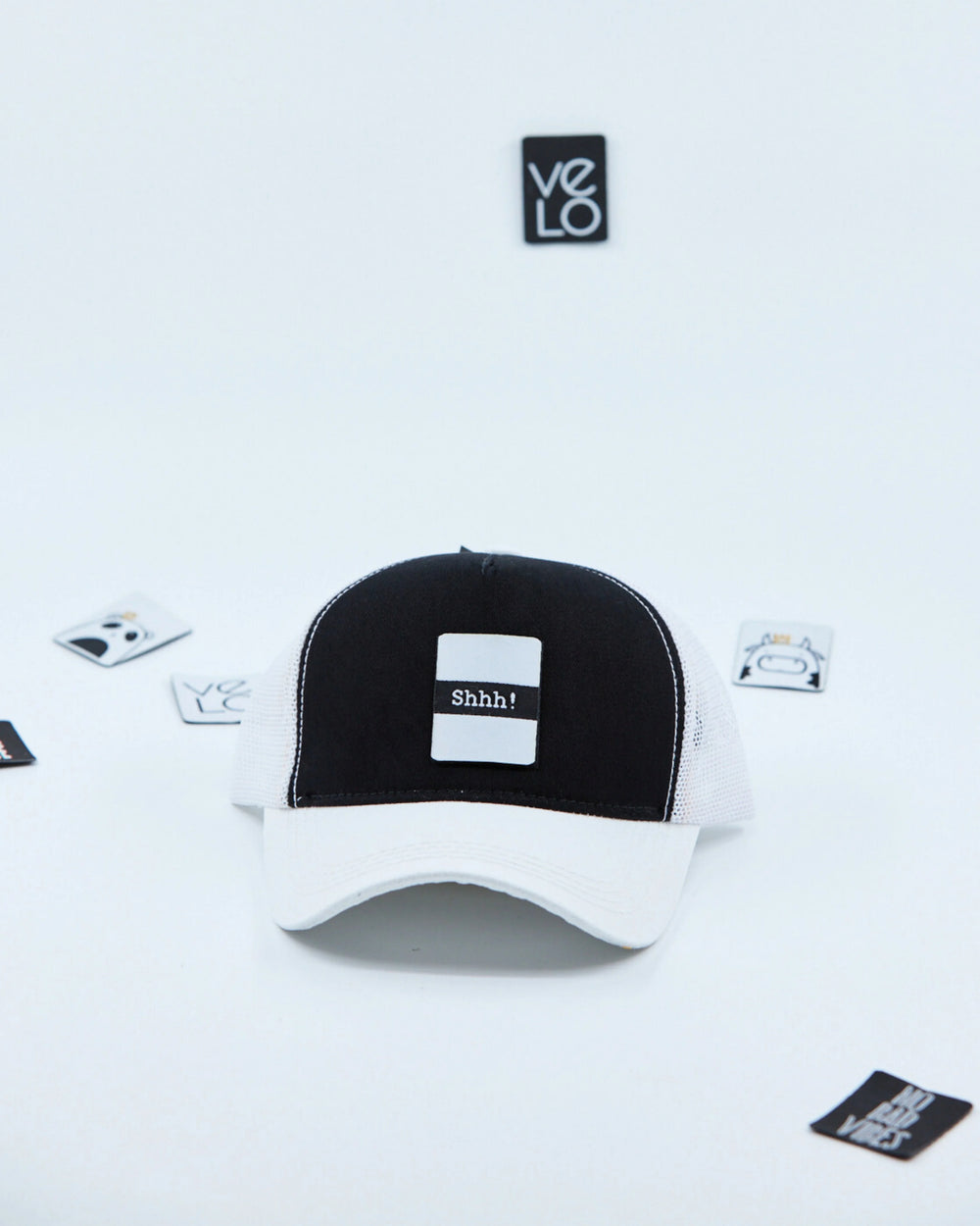 Front view of Black and White Customisable Trucker Cap