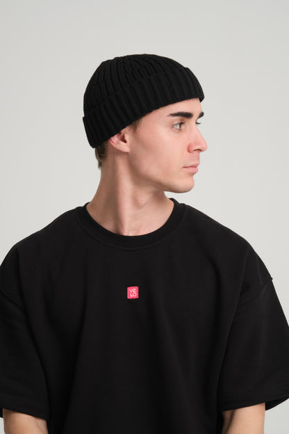side view of a man wearing Black Fisherman Beanie
