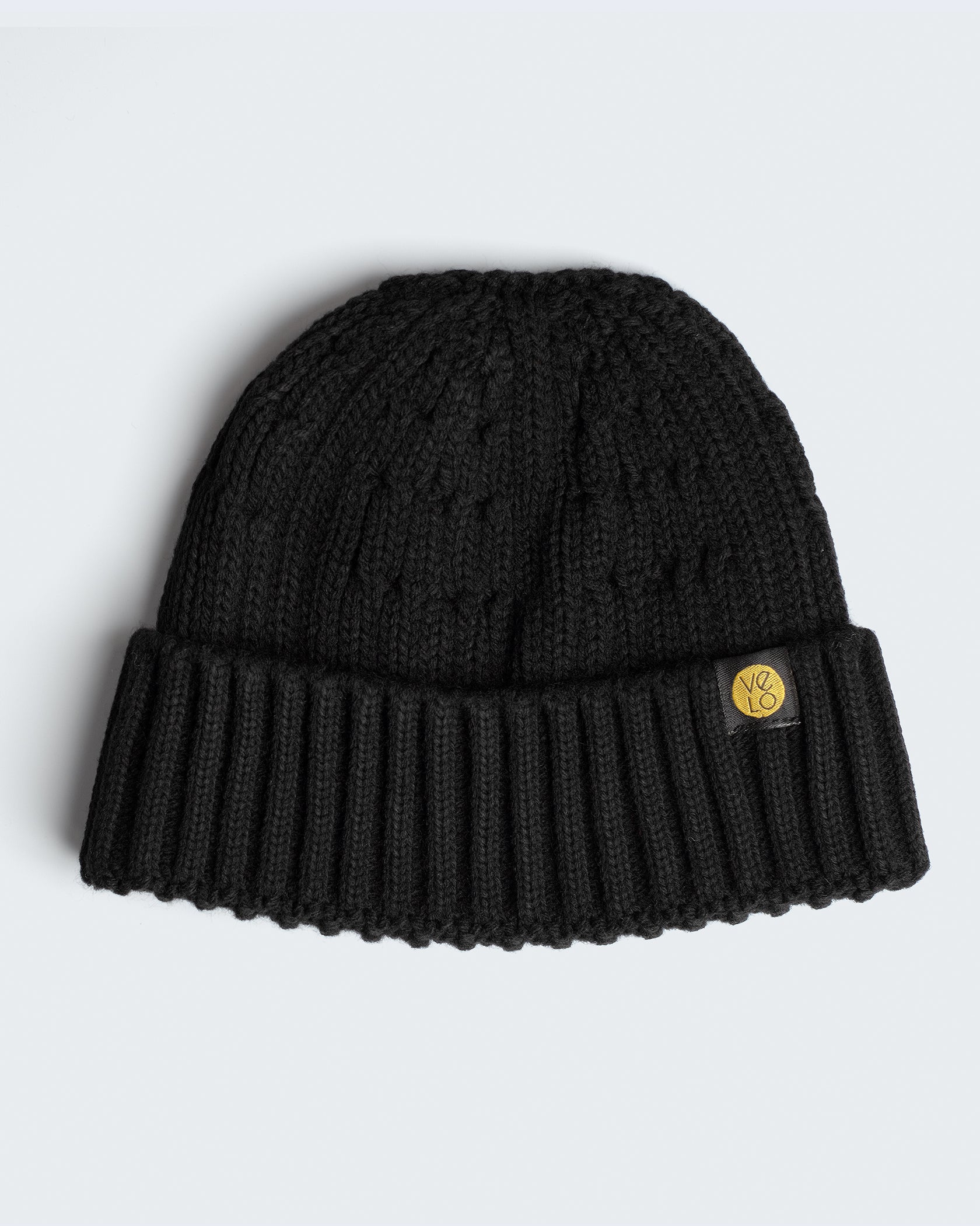 black fisherman beanie on a white background