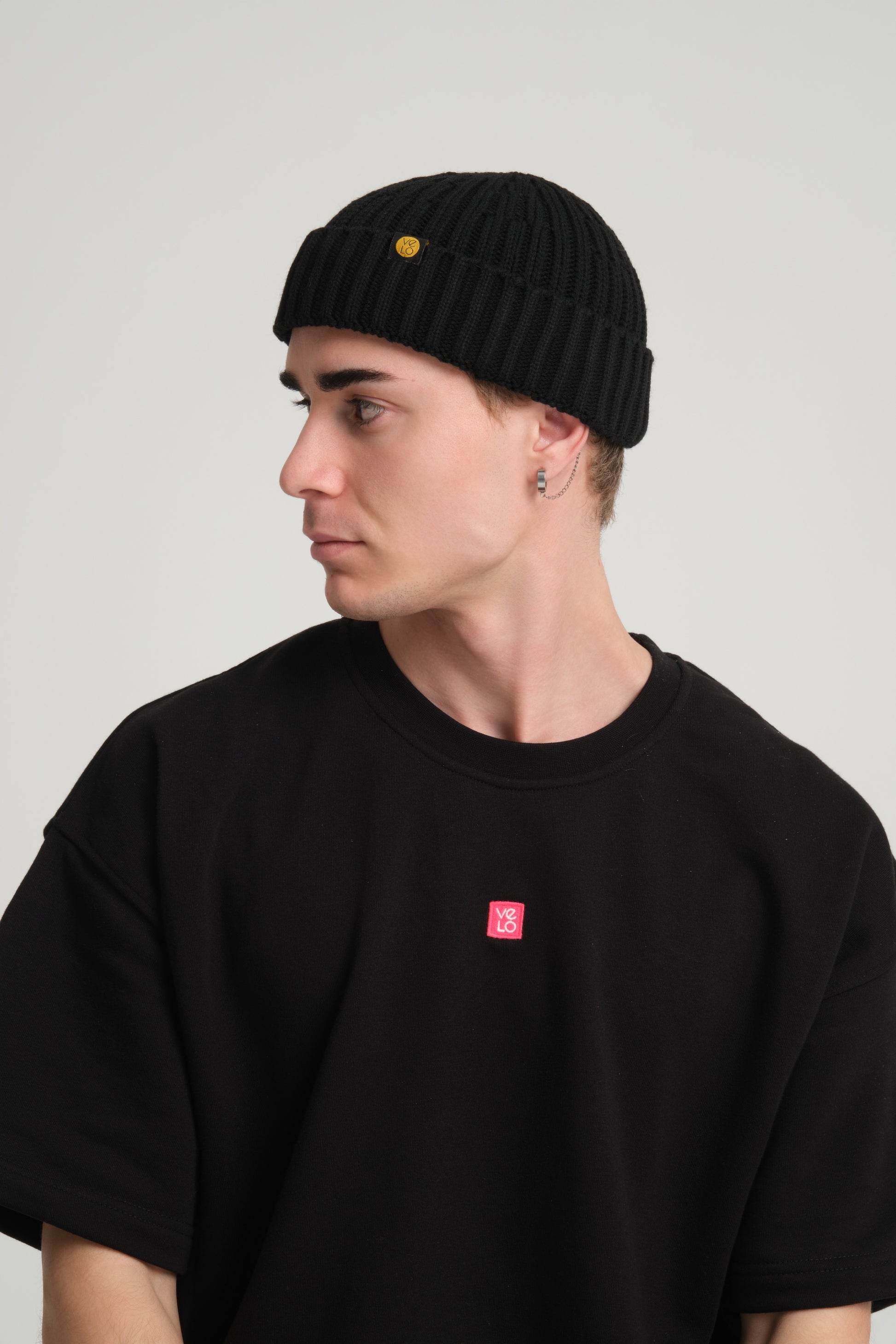 side view of a man wearing Black Fisherman Beanie