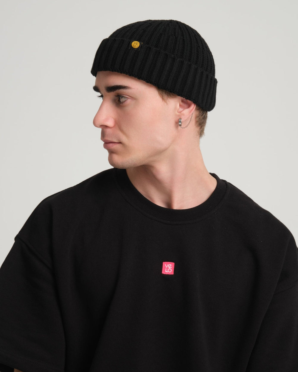 side view of a man wearing Black Fisherman Beanie