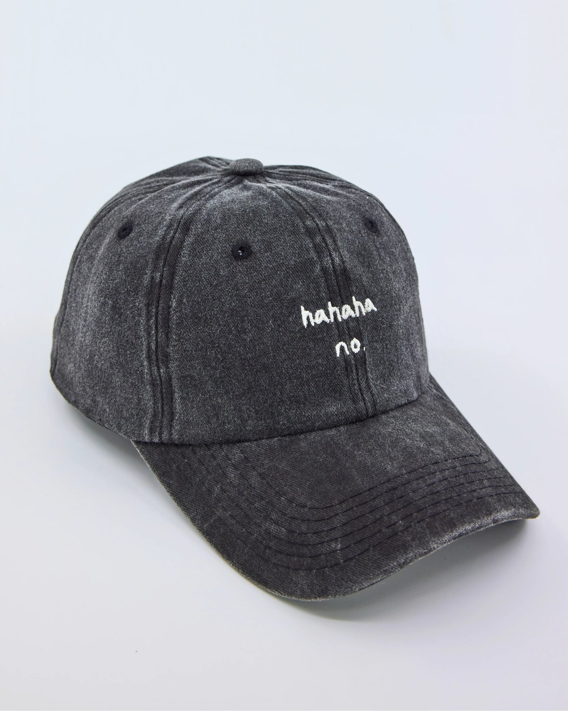 side view of Hahaha No Black Washed Cap