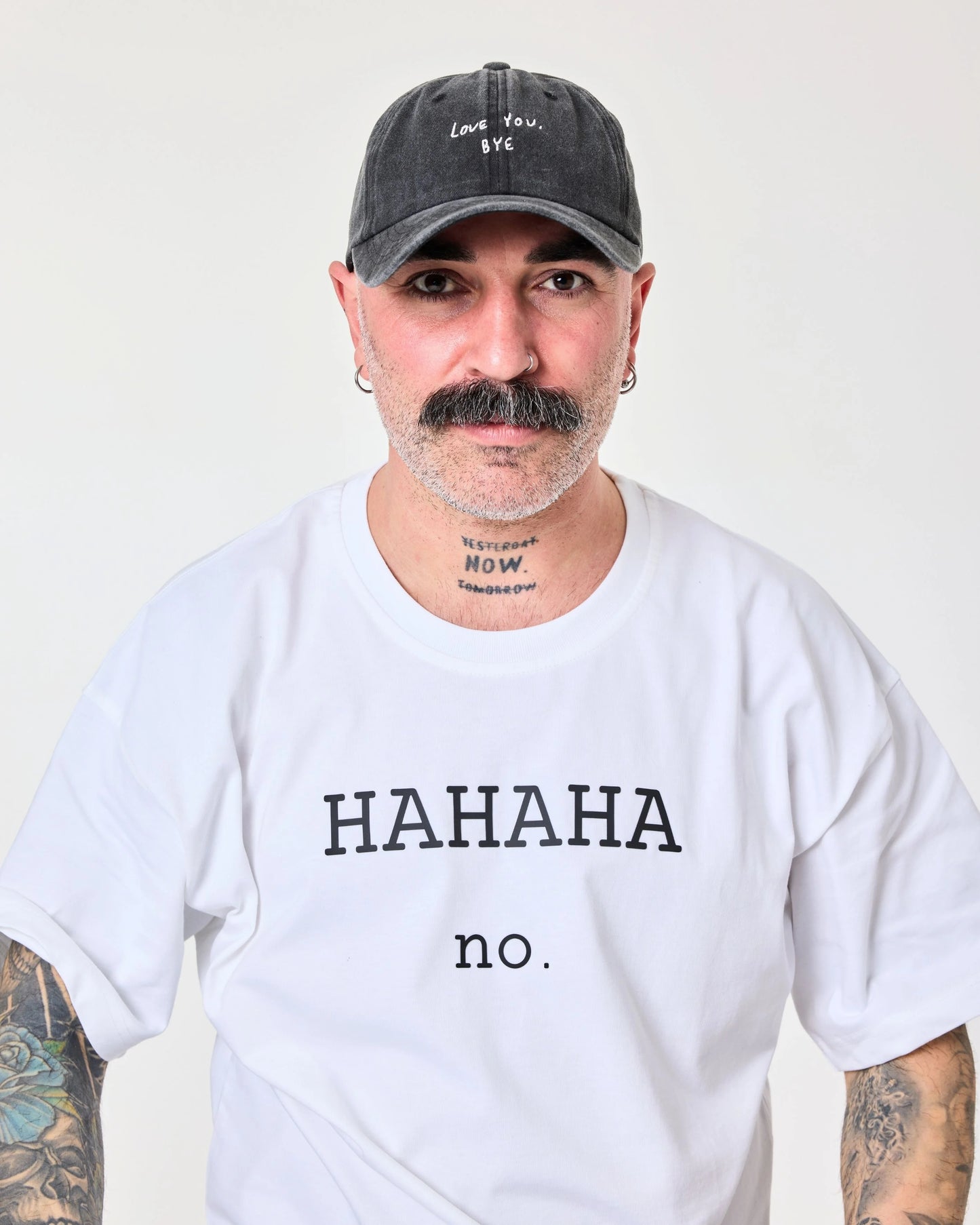 man wearing Black Washed Cap with Love You Bye embroidered in white