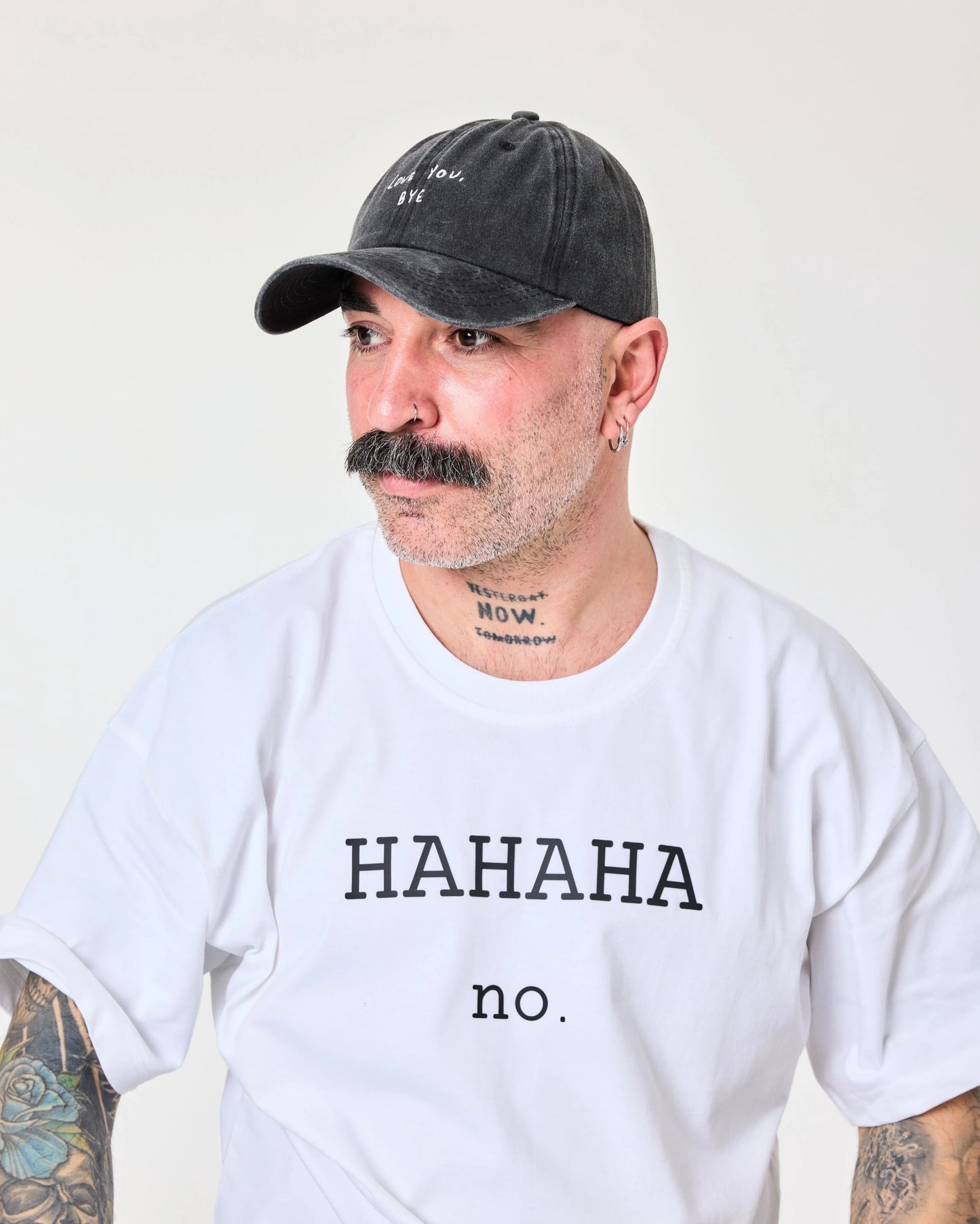 man wearing Black Washed Cap with Love You Bye embroidered in white