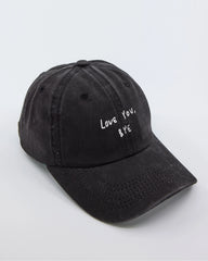 side view of Love You Bye Black Washed Cap
