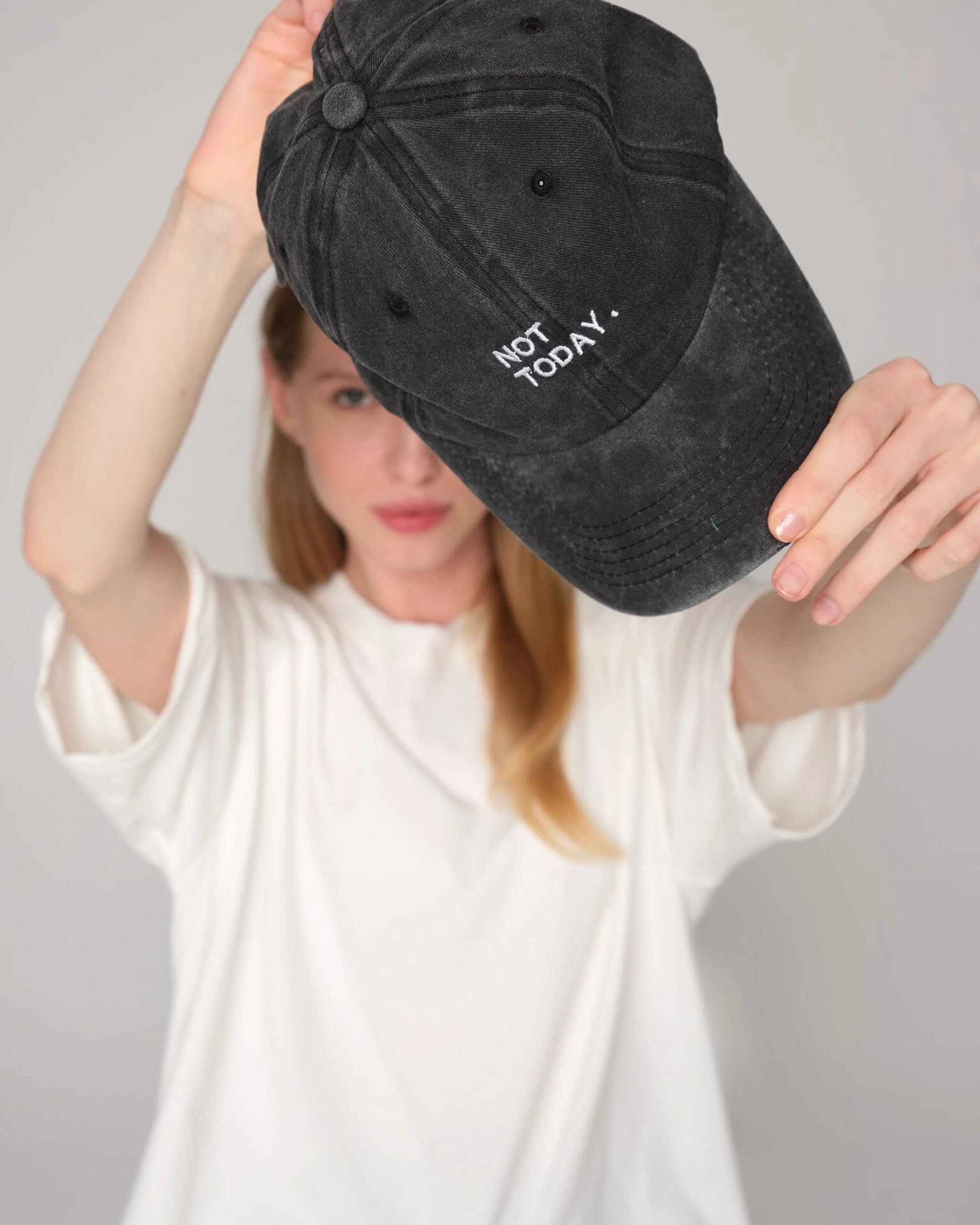 woman holding Not Today Black Washed Cap